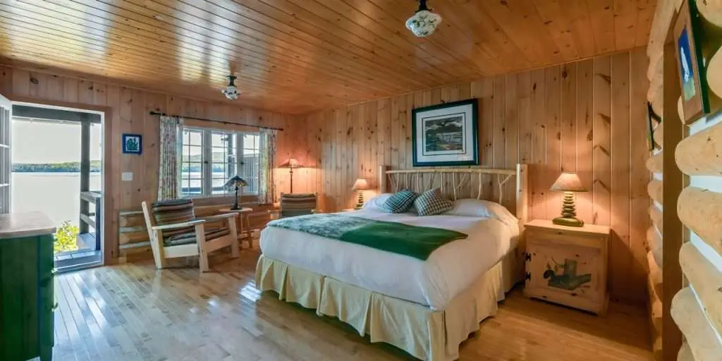 An interior of a lodge room with lake views at the luxury Killarney Lodge in Algonquin