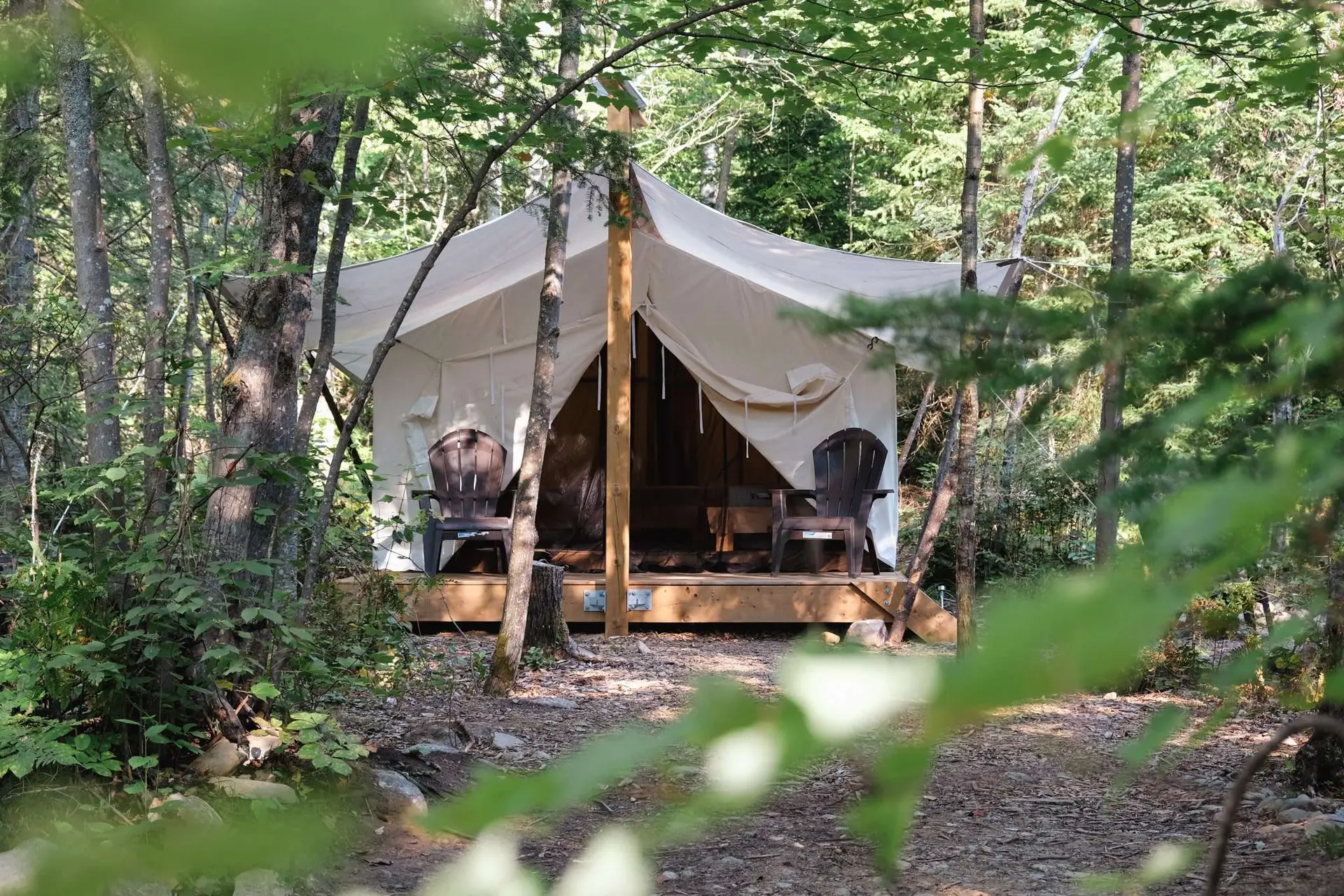 A glamping canvas tent at Four Corners Algonquin, which is a campsite near Algonquin Park