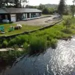 Arie shot of Algonquin Accommodations Rrolling Rapids Motel and river