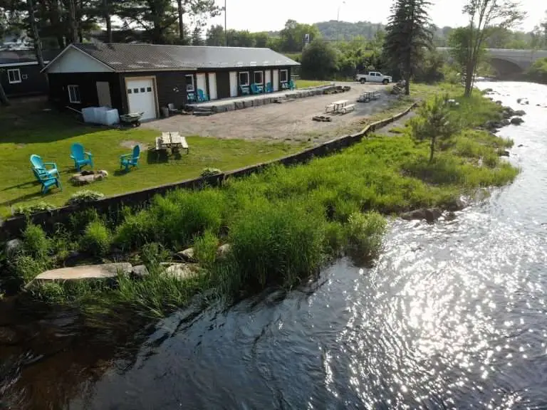 Arie shot of Algonquin Accommodations Rrolling Rapids Motel and river