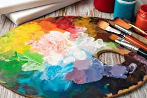 art palette with colorful mixed paints