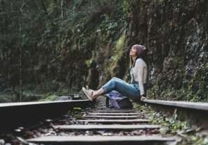 South Algonquin: A young woman is sitting on an old train rail