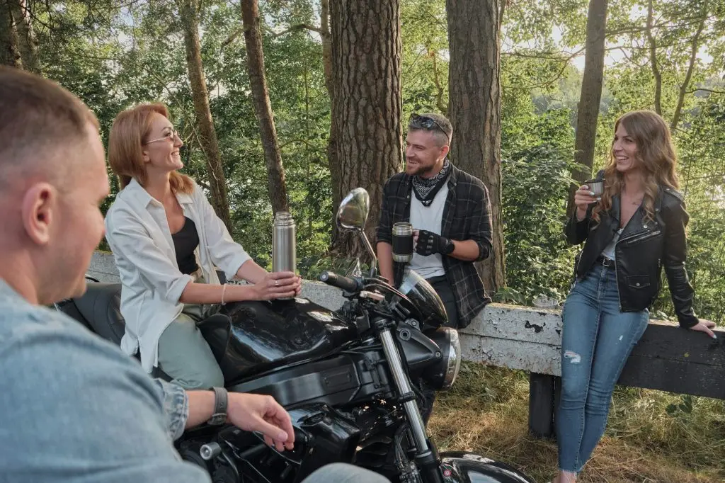 Meeting A company of friends of motorcyclists bikers on motorcycles stopped on the roadside