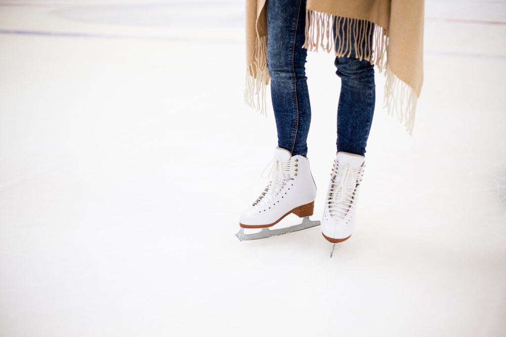 Girl standing on opened skating rink