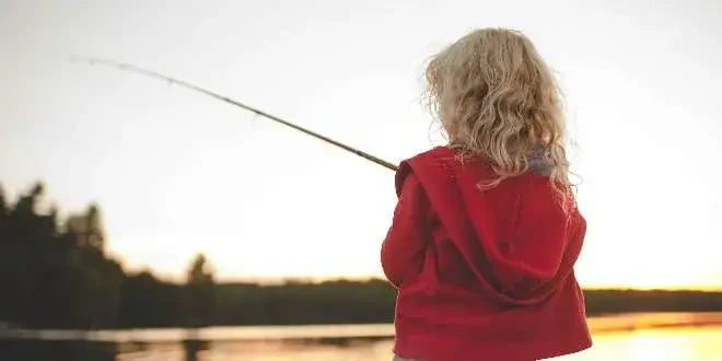 a young girl fishing