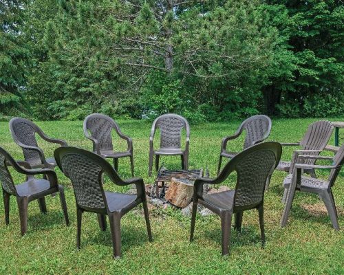 many chairs around the bonfire place