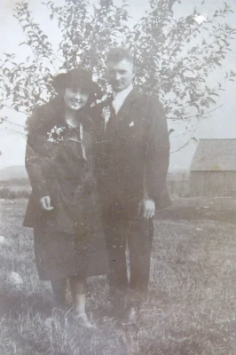 old image of couple standing outdoor