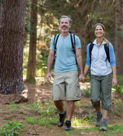 Hiker couple hiking in forest